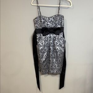 Vintage speechless silver prom dress with silvery details and black tie bow